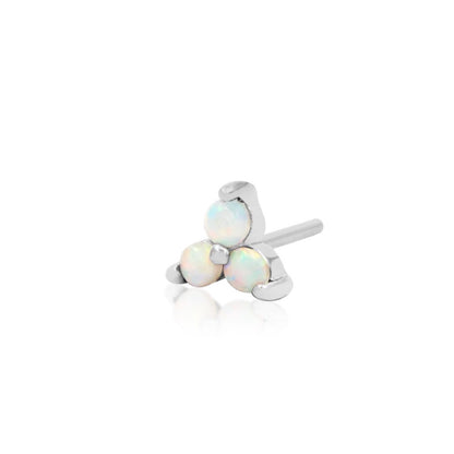 Three synthetic opals set in solid white gold creating a subtle focal point for a conch piercing.