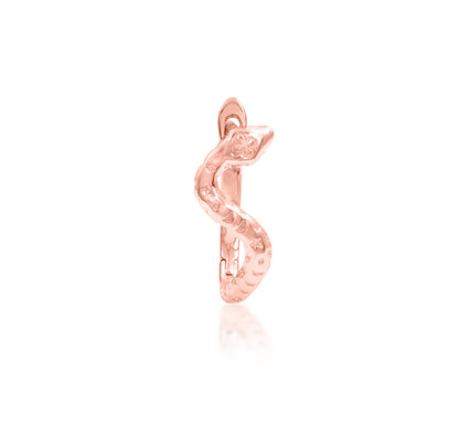 Alternative gold jewellery in rose gold, shaped as a mystical snake with celestial markings.