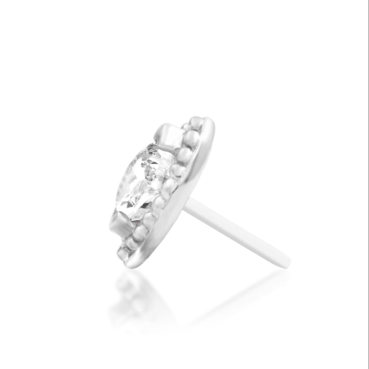 Compact white gold tragus earring with a brilliant marquise gemstone and softly textured gold beads