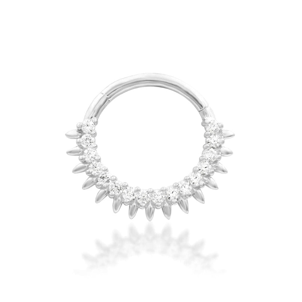 Celestial daith jewellery in 14k white gold, featuring the radiant sun-inspired shape of Junipurr Lovina.
