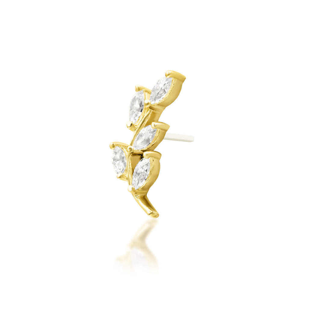 Angled view of Junipurr Vedia showing five marquise white CZ stones arranged across a curved yellow gold frame
