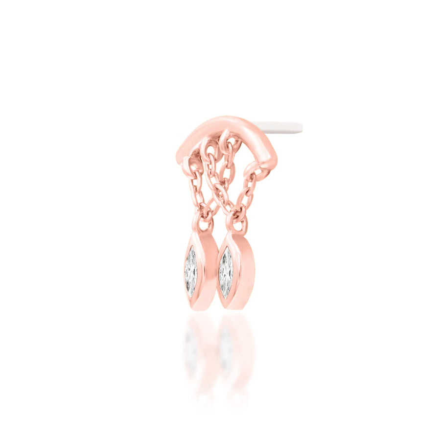 Delicate gold ear-stack jewellery in rose gold, adding movement and white CZ sparkle to a curated ear.
