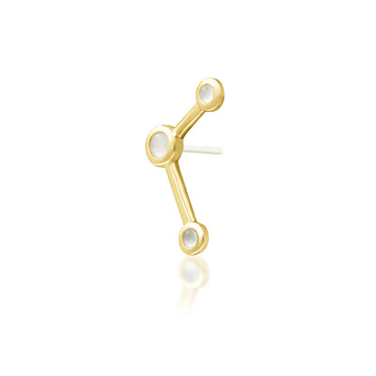 Angled view of yellow gold Junipurr Asteria showing its elongated three-moonstone design