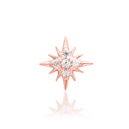Forward helix earring in 14k rose gold with Junipurr Supernova’s compact CZ starburst design.