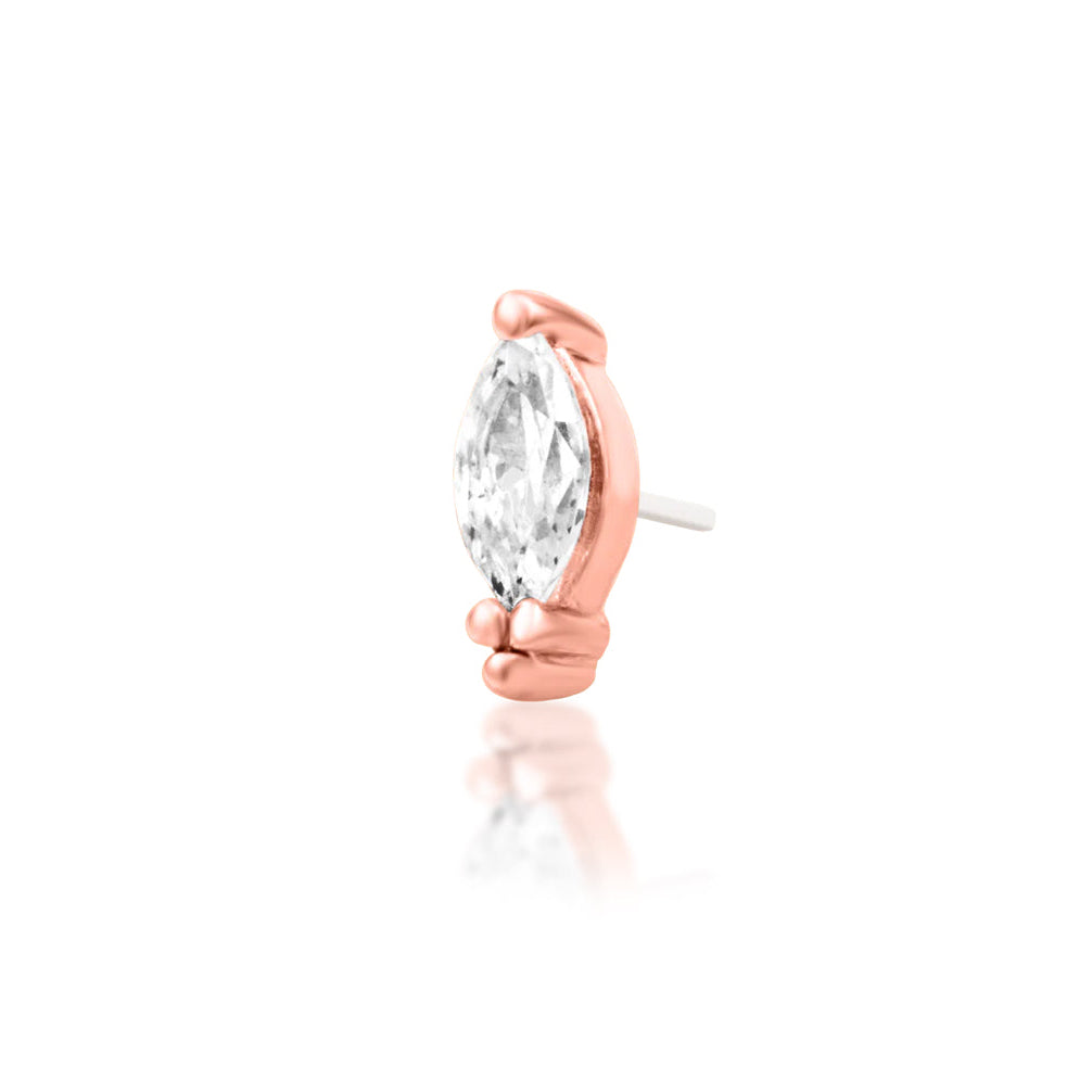 Forward helix earring in rose gold with the elongated cubic zirconia and three-bead setting of Junipurr Verda.