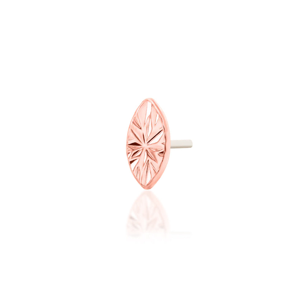 Gemstone-free gold jewellery in rose gold, using laser engraving to create reflective marquise detail.