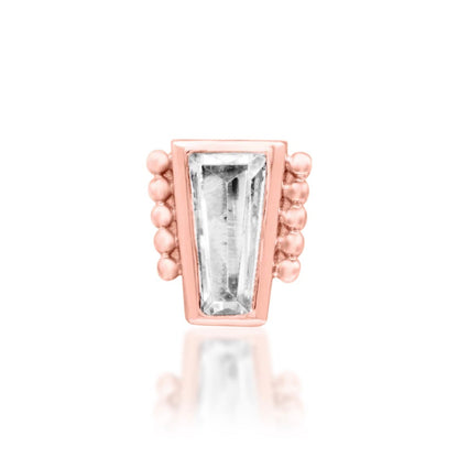 Geometric cartilage earring in solid rose gold, pairing a straight baguette CZ with rounded bead detailing.