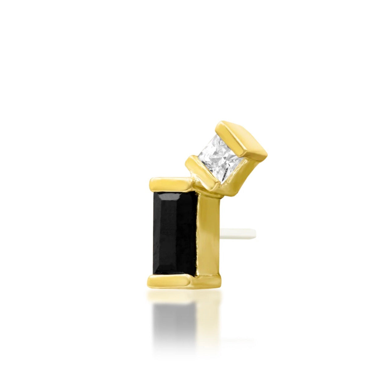 Yellow gold conch earring featuring a geometric arrangement of black and white cubic zirconia