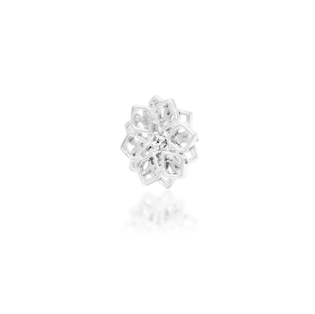 Geometric gold earring in white gold, combining pointed symmetry with a petite cubic zirconia accent.