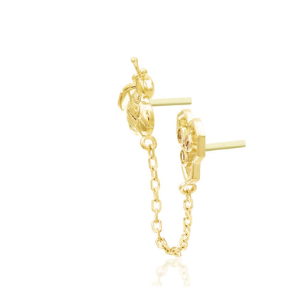 Gold cartilage jewellery featuring a sculpted bee and Dark Champagne CZ honeycomb