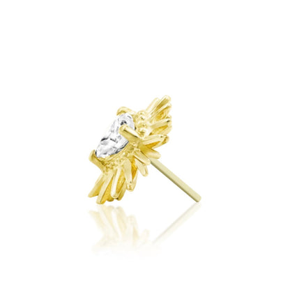 Gold cartilage jewellery featuring a heart gemstone within an edgy spiked frame