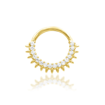 Gold sunburst daith ring in 14k yellow gold, featuring Junipurr Lovina with thirteen white CZ stones framed by polished rays.