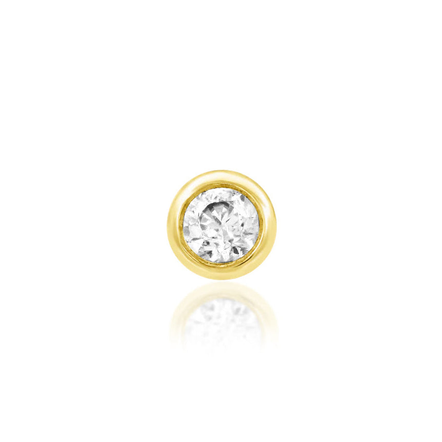 Junipurr gold tragus earring with a bezel-set white CZ in solid 14k yellow gold