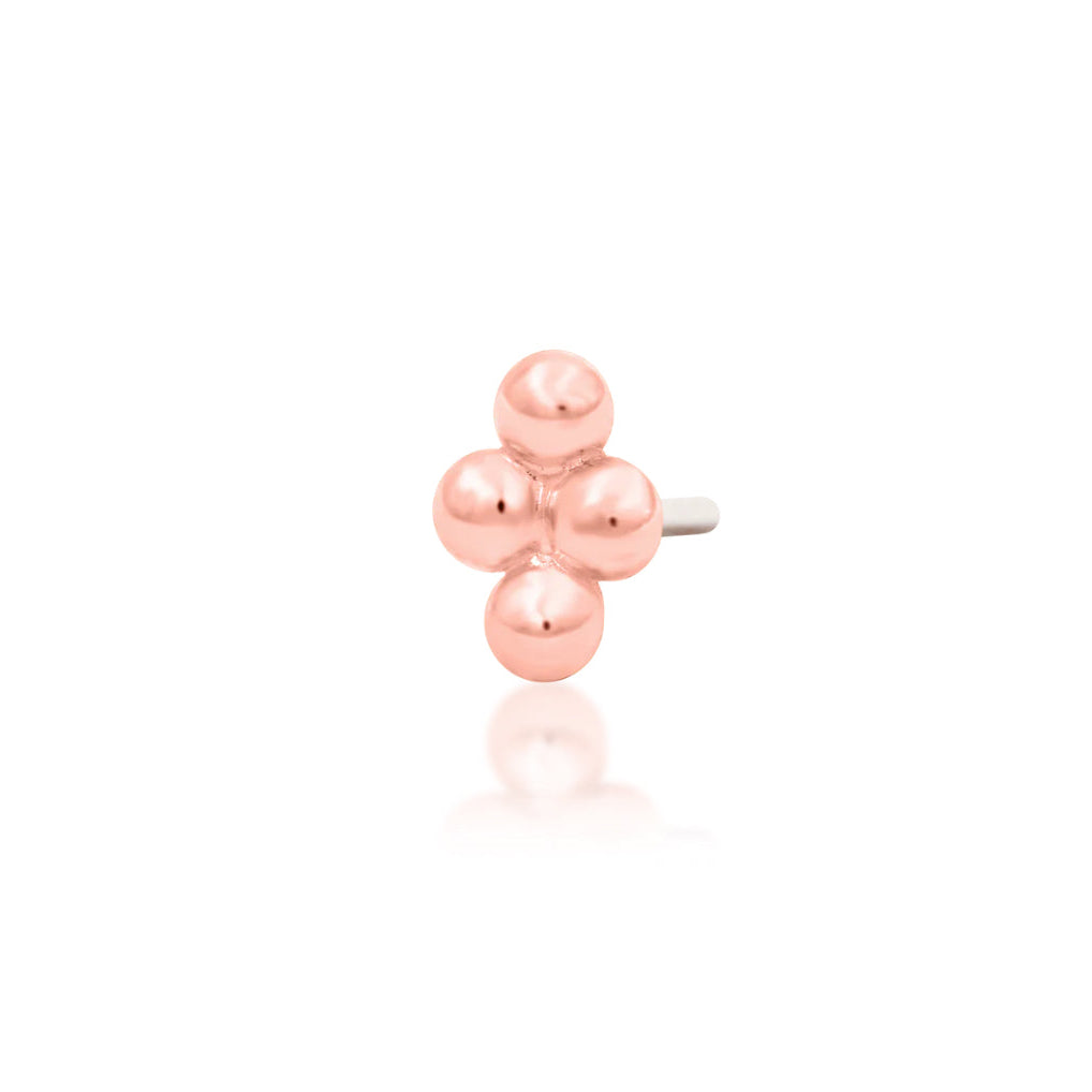 Gold tragus earring in 14k rose gold, featuring a petite bead cluster without gemstones.