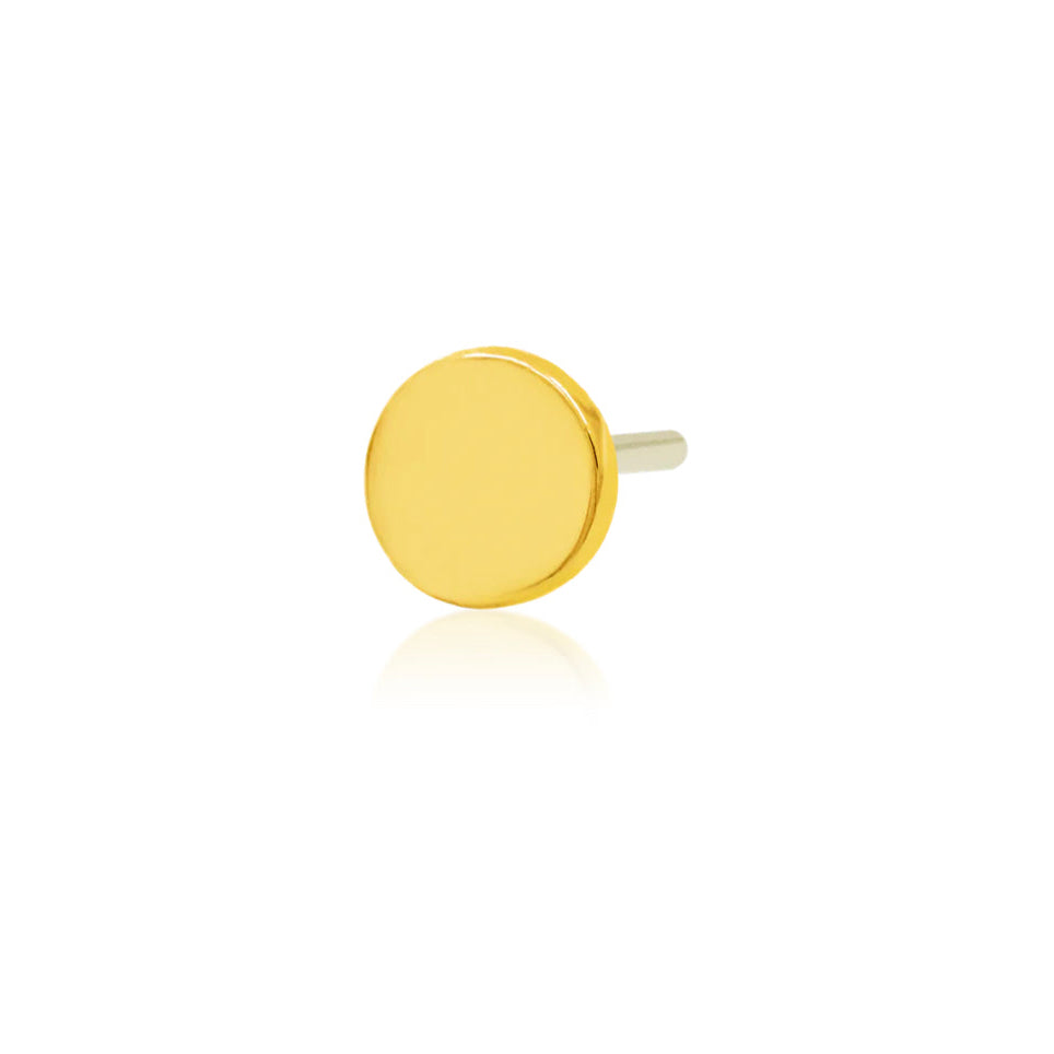    Minimal gold tragus earring featuring a smooth high-polish disk