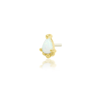 Gold tragus earring with a pear-shaped opal framed by delicate gold beads