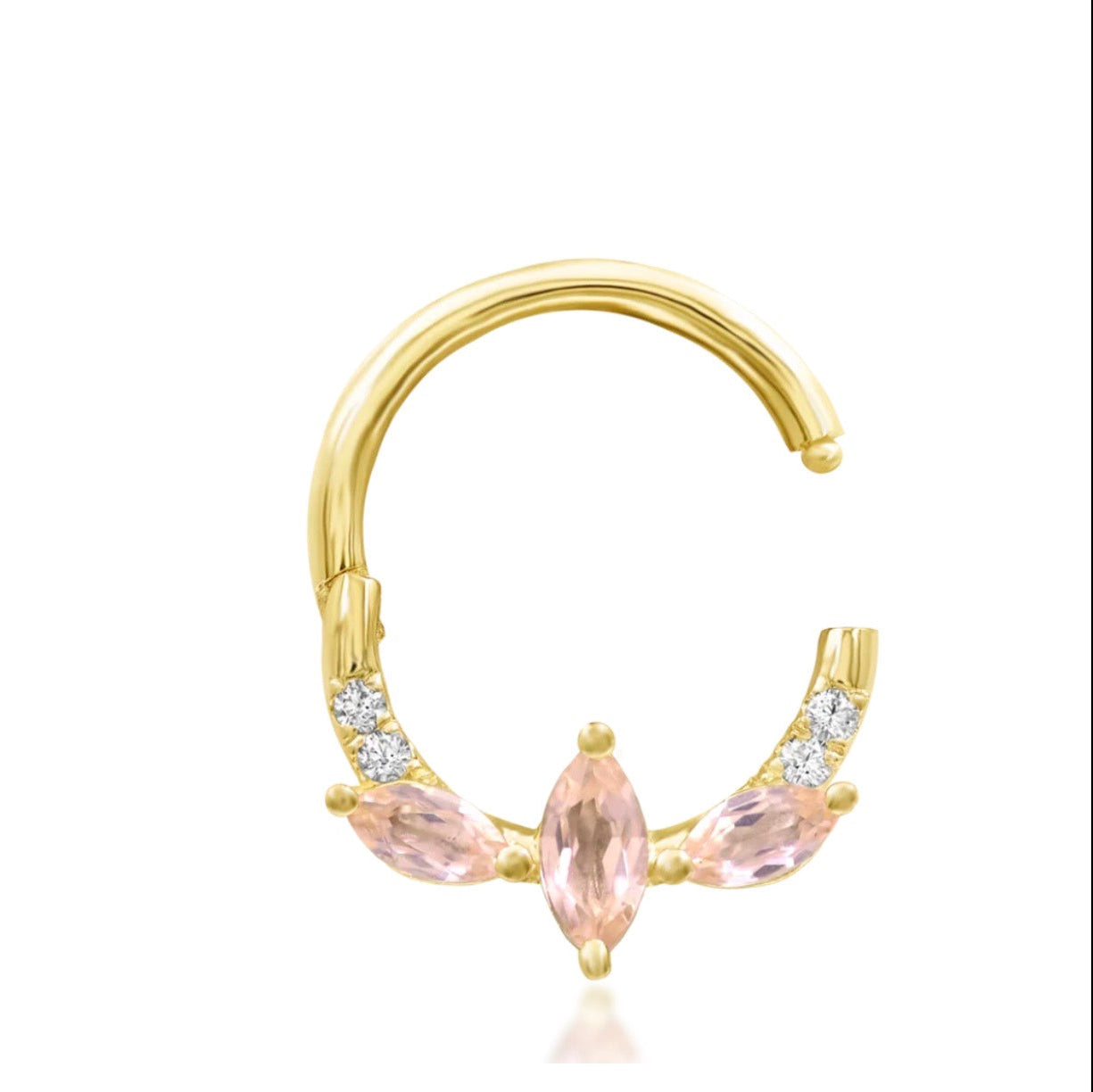 Gold gemstone clicker ring in yellow gold, shown with Parisa’s mix of elongated pink champagne and white CZ stones\.