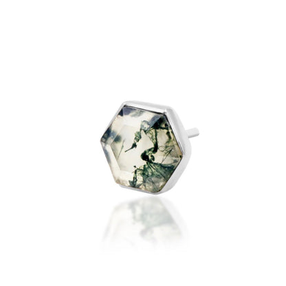 Angled view of white gold conch jewellery with a geometric moss agate centre stone