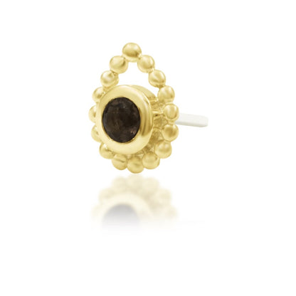 Junipurr Ashai yellow gold round smoky quartz end with a beaded border, shown at an angle.