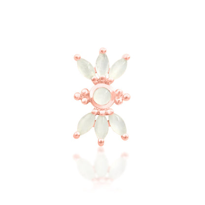 Junipurr Bette solid 14k rose gold threadless end with a moonstone sunburst, front view.