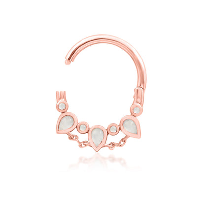 Junipurr Catalina solid 14k rose gold moonstone clicker ring, angled view.