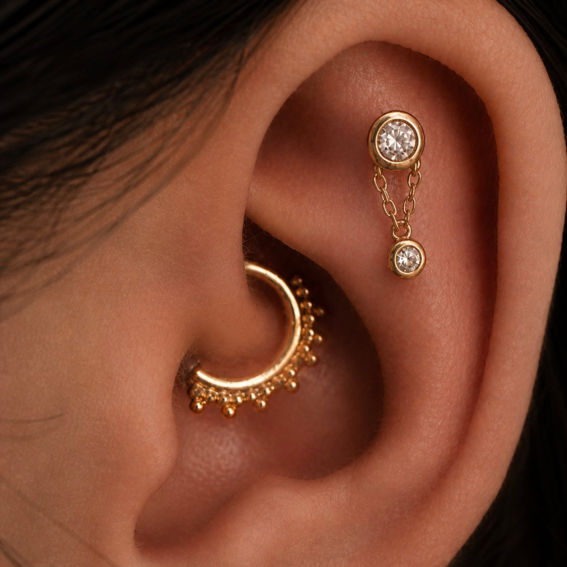 Junipurr Cora gold helix jewellery with Tri-Bead Clicker in a daith piercing