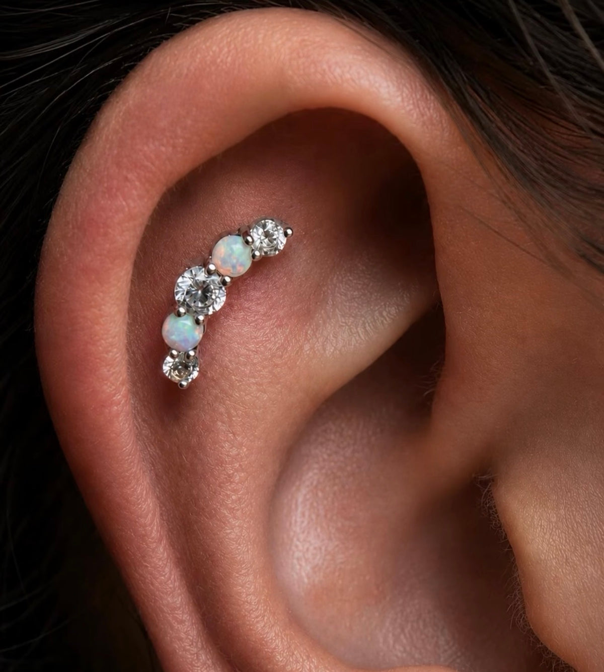Junipurr Dani opal and CZ gold jewellery worn in a flat piercing