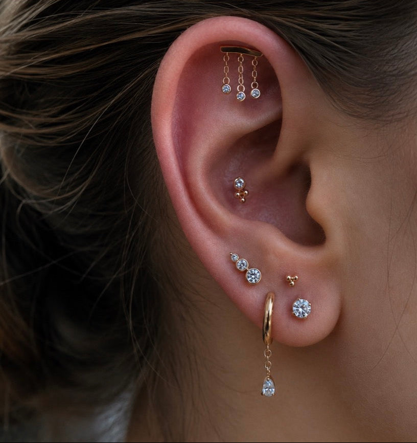 Curated gold ear with Junipurr Delilah, Tri-Bead and Tri-Bead CZ Bezel jewellery