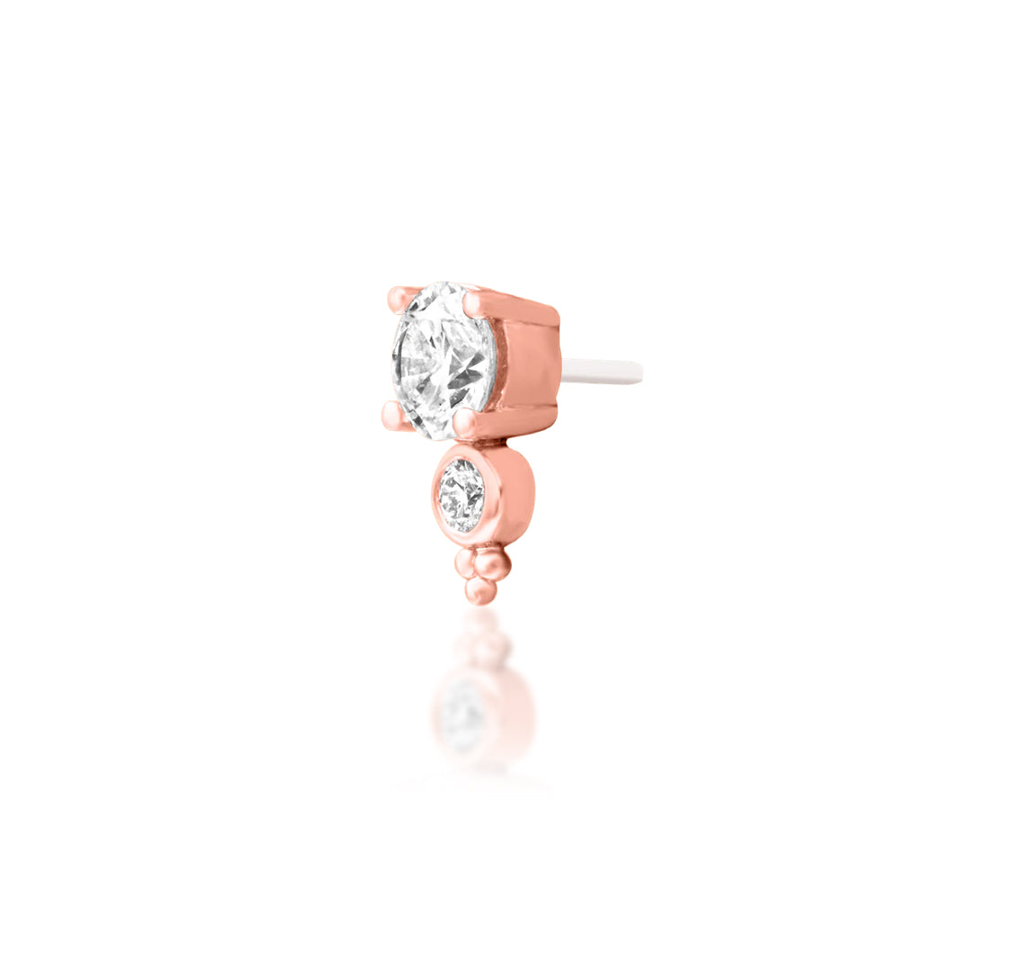 Junipurr Ecstatic solid 14k rose gold threadless end with two graduated lab-grown diamonds, angled view.