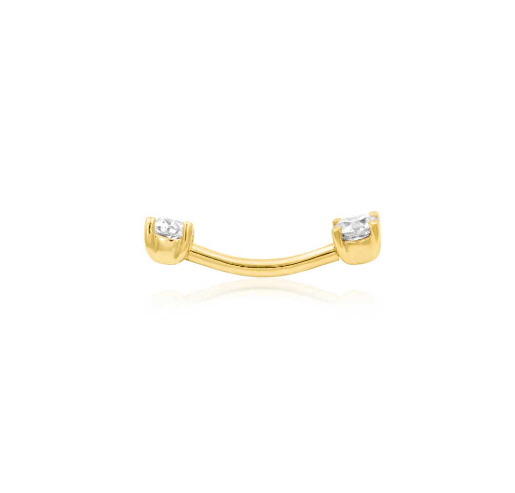 Junipurr Empress solid 14k gold curved barbell worn in a rook piercing, showing both forward-facing White CZ stones.