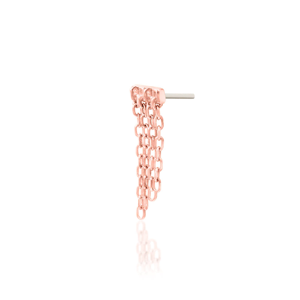 Side detail of Junipurr Imogen in solid 14k rose gold showing the elongated upper setting and cascading chains.