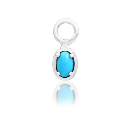 Junipurr Micah solid 14k white gold charm with an oval synthetic turquoise gemstone, front product view.