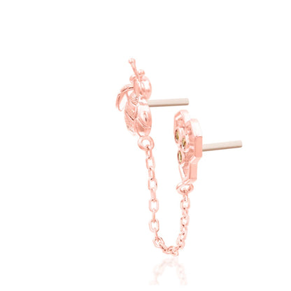 Junipurr Oh Honey solid 14k rose gold showing the sculpted motifs and articulated connecting chain.
