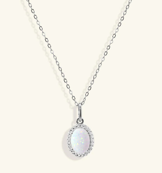 Junipurr Olenis white gold necklace with an oval opal pendant and gemstone halo. – alternate view
