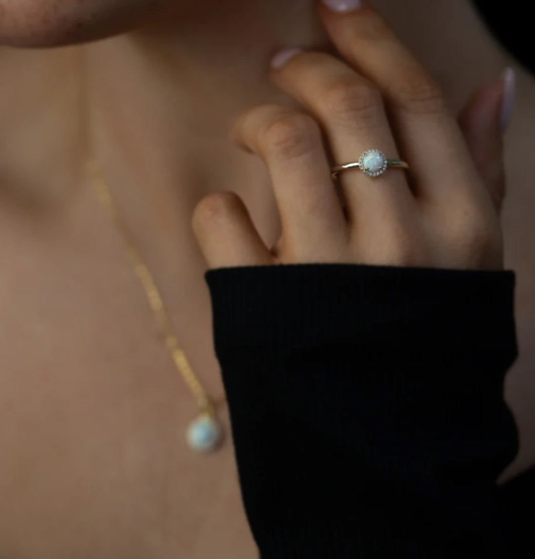 Junipurr Ophelis gold ring with a 5mm synthetic opal and cubic zirconia accents, product view.