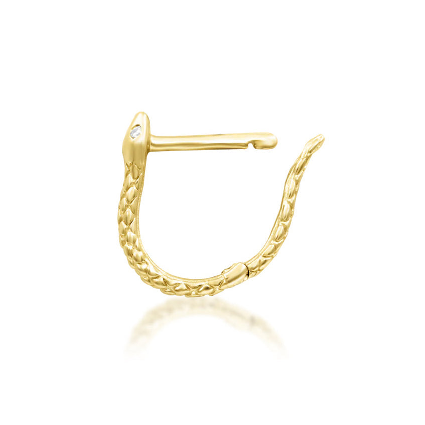 Junipurr Ophis snake huggie earring in solid 14k rose gold with a textured body and two white CZ eyes.
