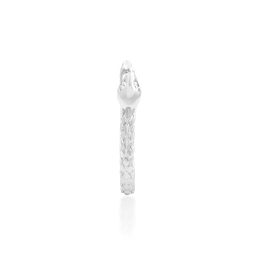 Solid 14k white gold Junipurr Ophis huggie shaped as a textured serpent with white CZ eyes. eyes.