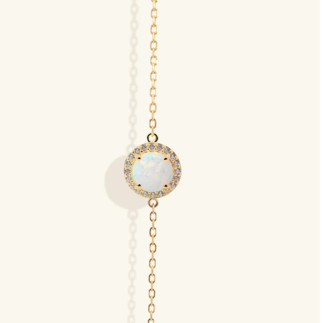 Junipurr Orvanna gold vermeil bracelet with synthetic opal and cubic zirconia accents, front view.