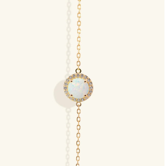 Junipurr Orvanna gold vermeil bracelet with synthetic opal and cubic zirconia accents, front view.
