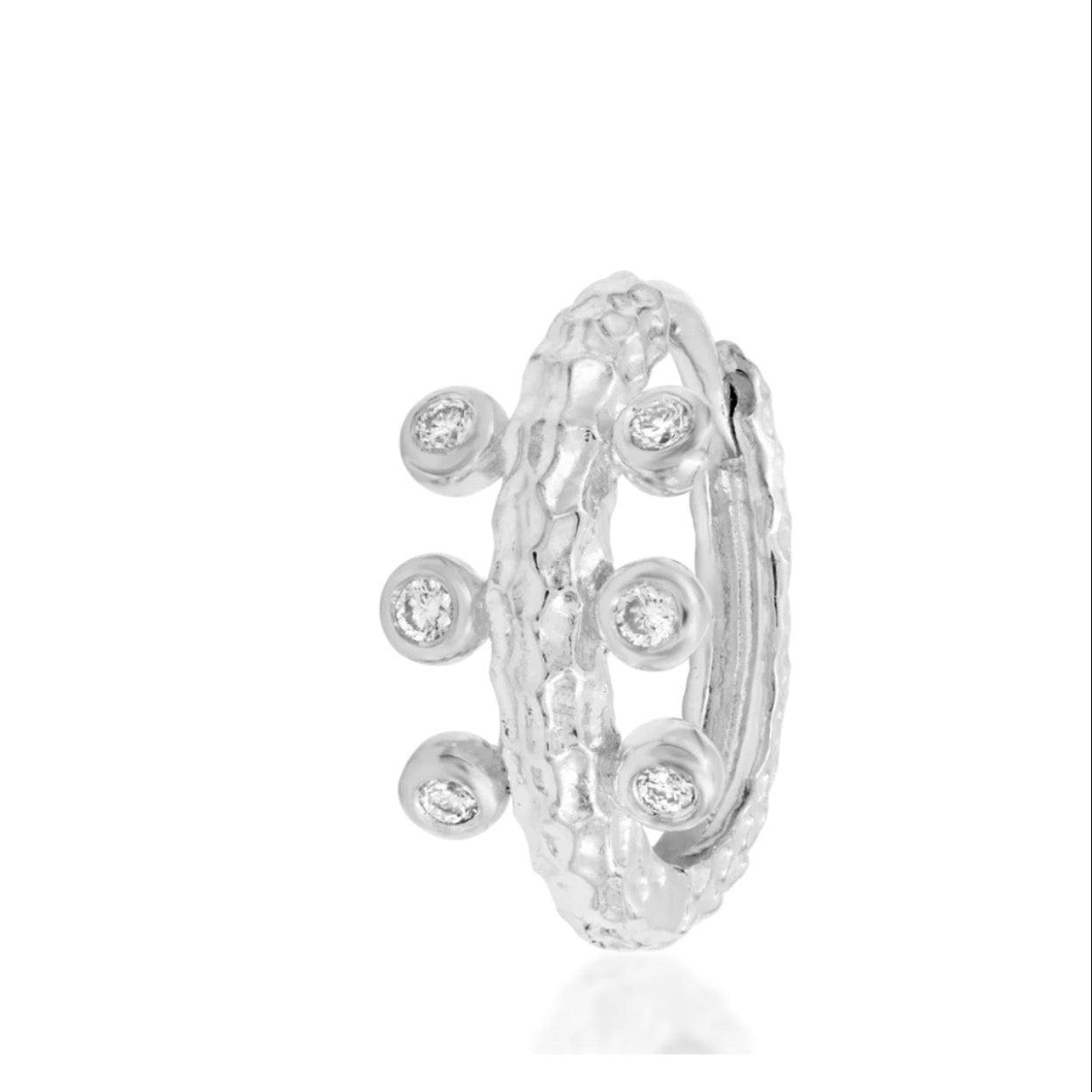 Open Junipurr Rora statement hoop in white gold, featuring a textured band and six gemstone details.