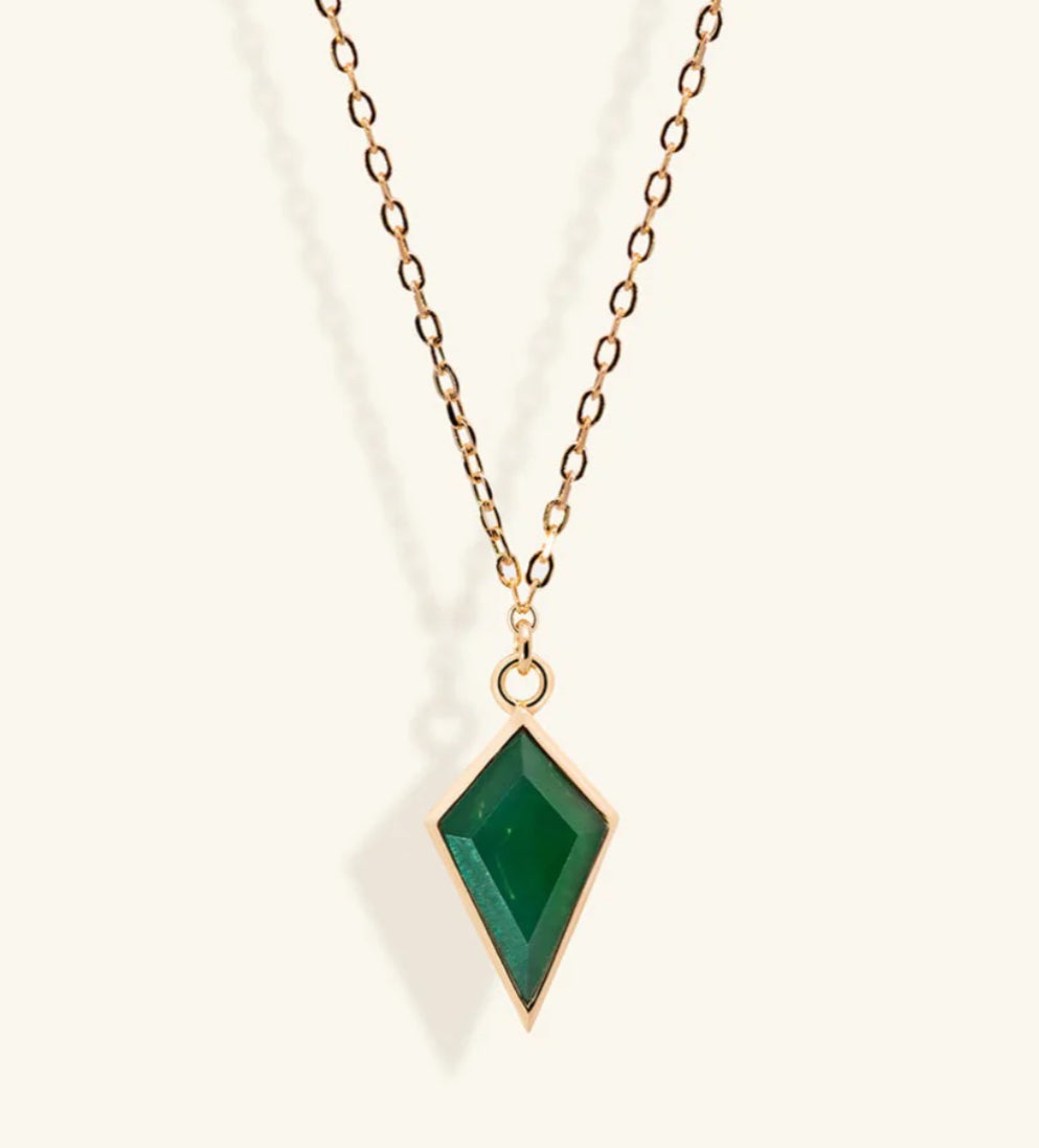 Junipurr Ulan gold necklace with a green cubic zirconia pendant, product view.