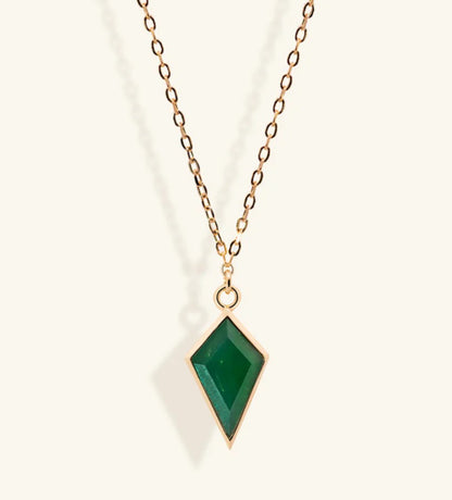 Junipurr Ulan gold necklace with a green cubic zirconia pendant, product view.
