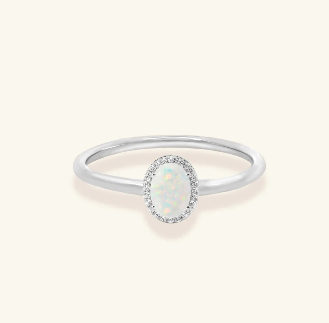 Junipurr Uzara halo ring with opal centre and cubic zirconia accents, product view.