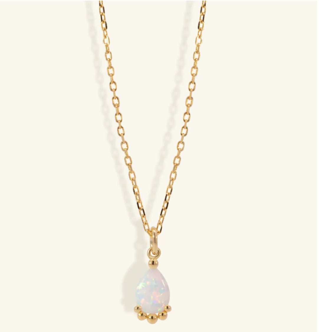 Junipurr Uzira gold necklace with a 6mm × 8mm synthetic opal pendant, product view.