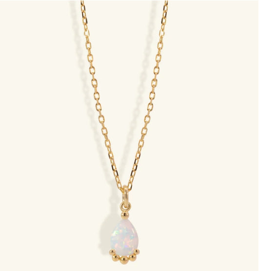 Junipurr Uzira gold necklace with a 6mm × 8mm synthetic opal pendant, product view.