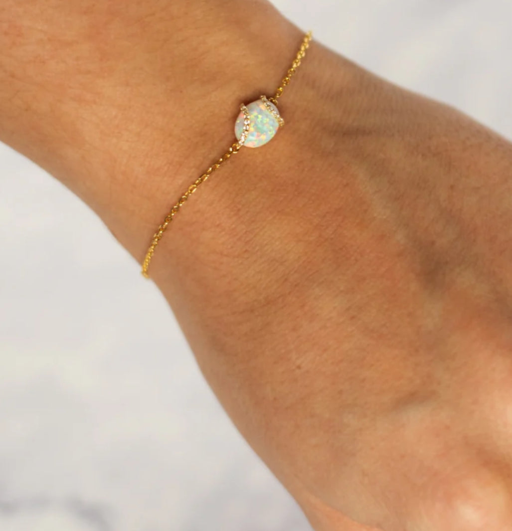 Junipurr Vasara gold-vermeil bracelet with a synthetic opal centre and cubic zirconia halo, product view.