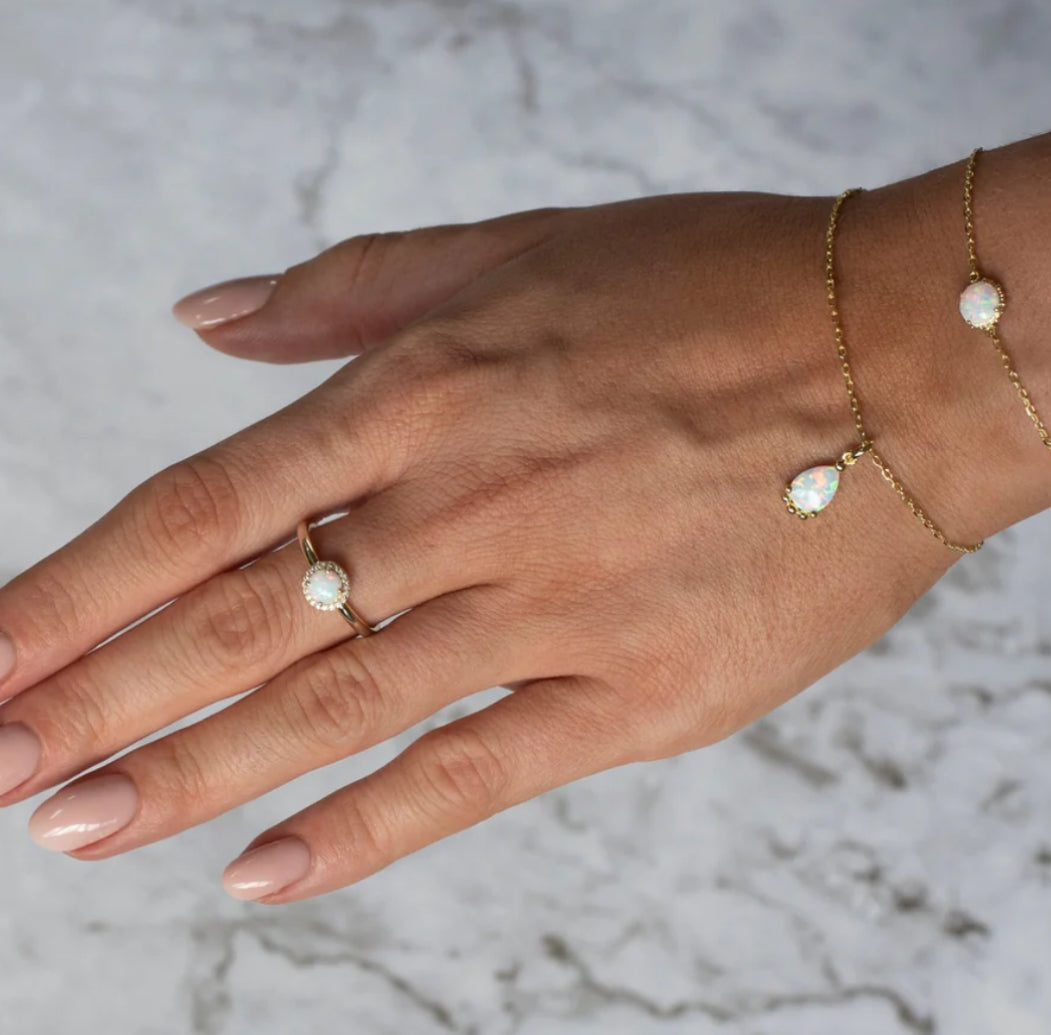 Junipurr Viera gold opal pendant bracelet with five bead accents, product view.