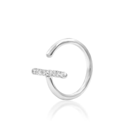 Minimalist crystal jewellery in 14k white gold, with nine white CZ stones forming Xaven’s refined centre line.