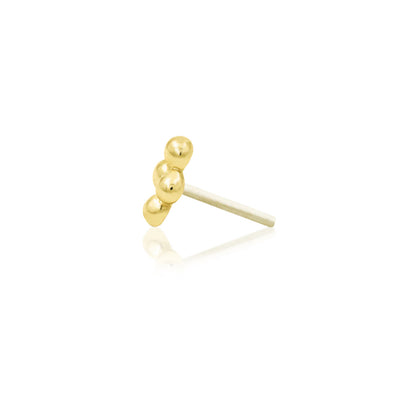 Minimalist gold piercing jewellery in solid yellow gold, featuring a small gemstone-free beaded design.