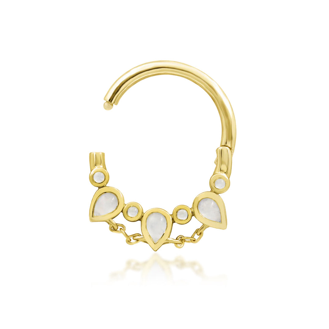 Moonstone clicker ring in yellow gold showcasing Catalina’s graduated pear-shaped moonstones.
